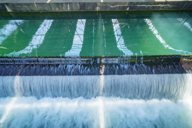 This image captures the discharge of industrial wastewater flowing into a water body. It highlights issues of pollution and environmental impact, showcasing drainage and water quality concerns.