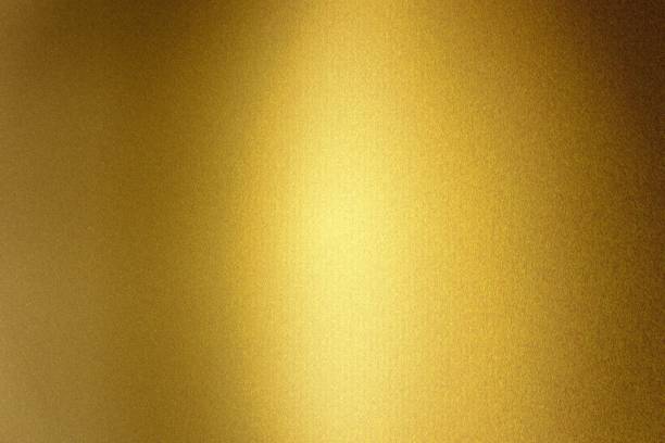 istock Light shining on gold metallic foil wall, abstract texture background 1169919663