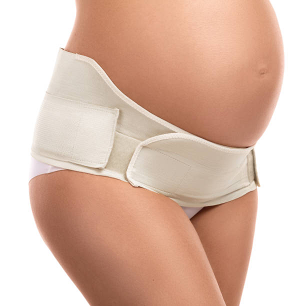 belly of pregnant woman with elastic maternity  band - waistband imagens e fotografias de stock