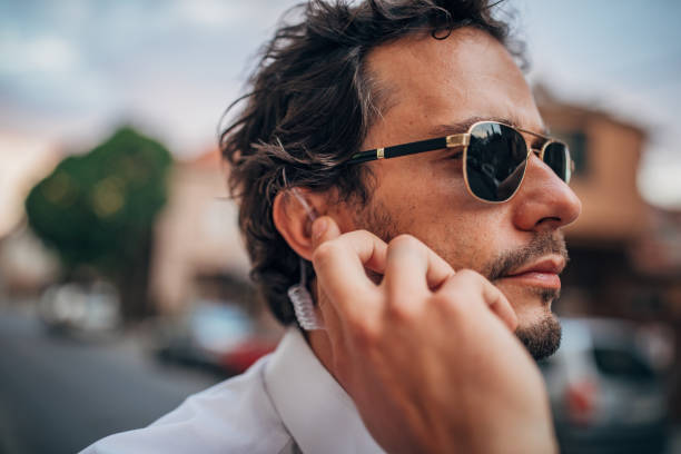istock Man detective receiving information on headphone 1169925207