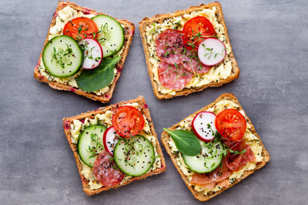 istock Sandwiches with cream cheese, vegetables and salami. 1169925266