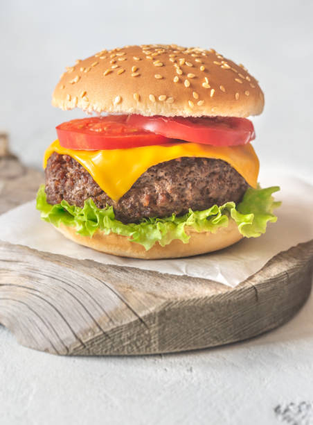 istock Hamburger on the wooden board 1169925744