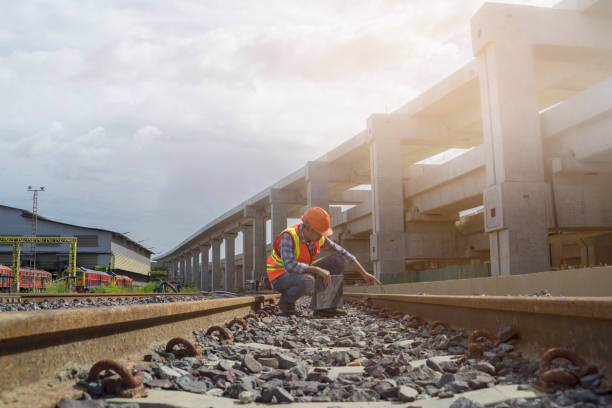 Worker checking track of  mass transit Engineer checking track of railway before  grand opening railway bridge photos stock pictures, royalty-free photos & images