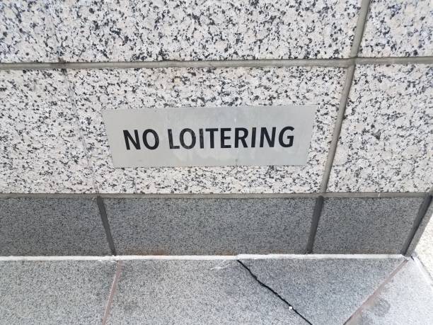 istock no loitering sign on black and white granite or marble wall 1169927753