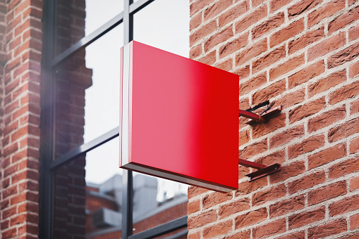 Blank red square store signboard Mockup. Empty shop Street sign, signage template mounted on the wall. , 3d rendering.