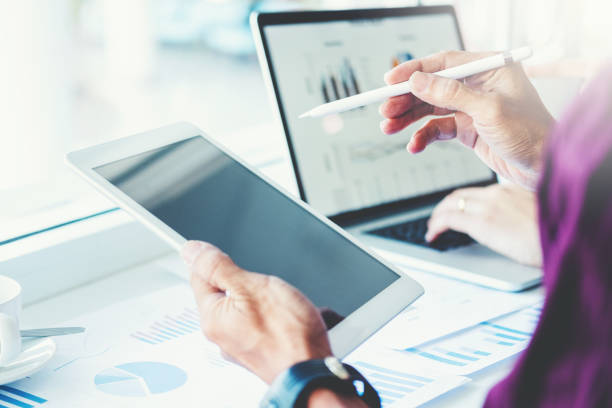istock Co-working Business Team Consulting meeting Planning with digital tablet Strategy Analysis investment and saving concept. meeting discussing new plan financial graph data. 1169928933