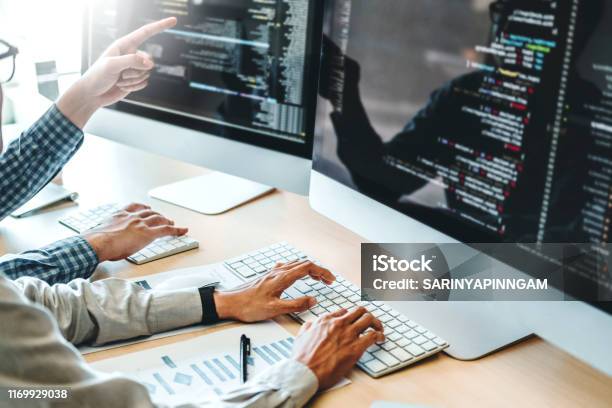 Developing Programmer Team Development Website Design And Coding Technologies Working In Software Company Office Stock Photo - Download Image Now