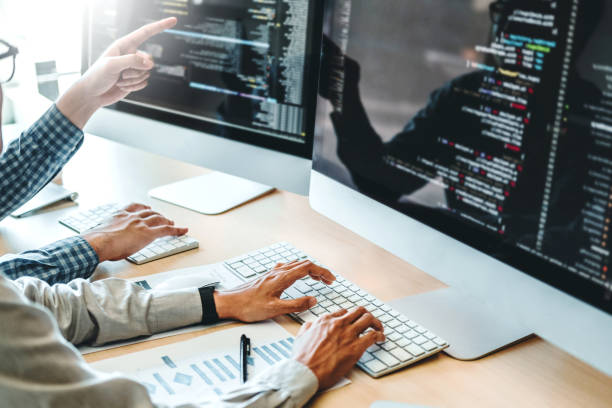 developing programmer team development website design and coding technologies working in software company office - programador imagens e fotografias de stock