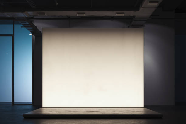 istock Illuminated blank white Canvas placard or billboard or wall in showroom, 3d rendering. 1169929341