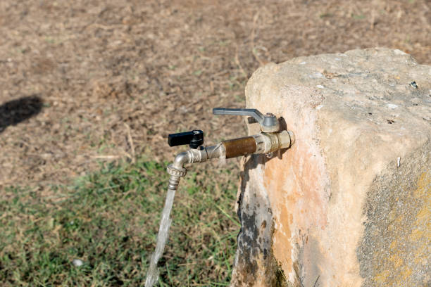 istock Fountain with open faucet and flowing water 1169934625