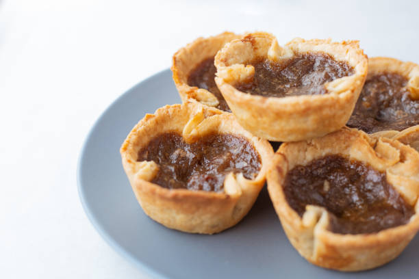 Homemade Canadian raisin butter tarts in a kitchen.