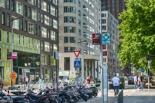 Amsterdam, Gustav Mahlerlaan, the Netherlands, 05/29/2019, Sky scrapers, Modern office buildings in Amsterdam, Cars, Bicycles,  parked in the streets,
