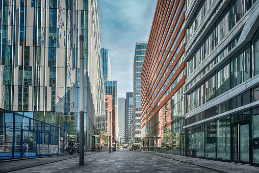 Amsterdam, Claude Debussylaan, the Netherlands, 08/23/2019, Street in the Amsterdam Zuidas (South axis) business district, modern office buildings, Sky scrapers, bars, cafe, shopping