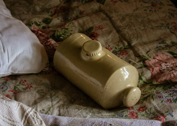 Vintage stoneware hot water bottle, also known as a pig.
