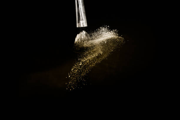 istock golden powder splash and brush 1169942214