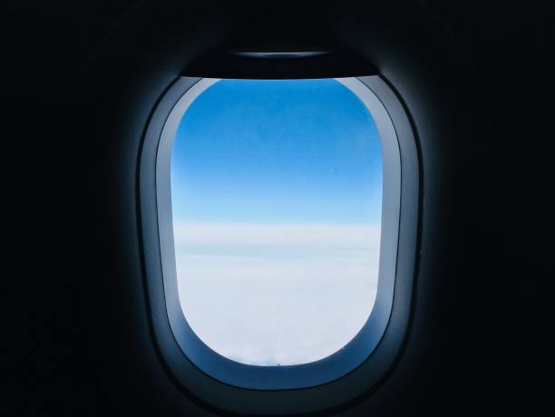 istock Aircraft window mid-air / blue sky 1169947322