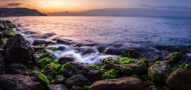 Landscape of the Dawn from Pietra Ligure's beach. stock photo