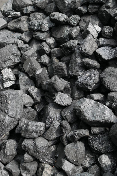 istock Pile of natural black hard coal or diamond coal background 1169948230