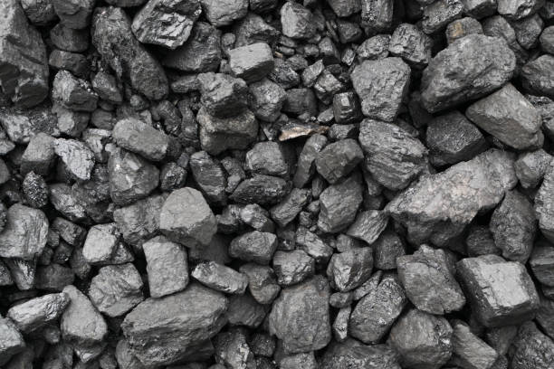istock Pile of natural black hard coal or diamond coal background 1169948258