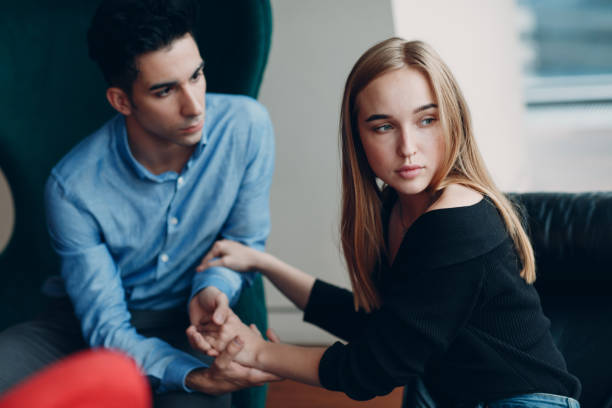istock Young couple man and woman hold hands 1169948603