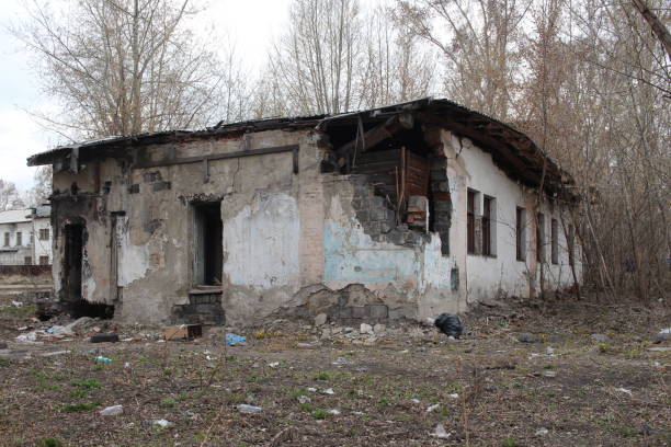istock old destroyed building with broken broken broken glass in the Windows non-residential premises house with dangerous debris falls 1169948625