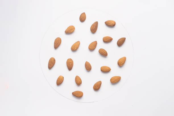 istock Almond nuts isolated on white backgroud. 1169949977