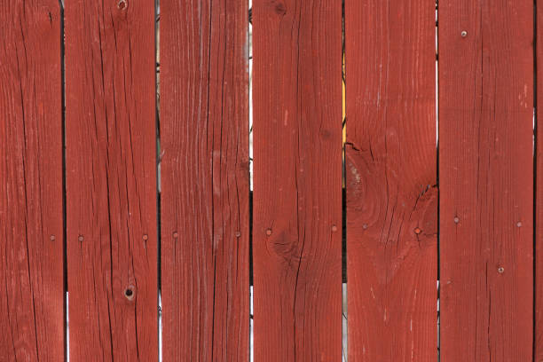 istock Old fence with peeling oil paint. 1169953082