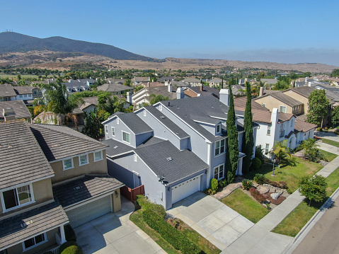 Aerial view of suburban neighborhood street with big villas next to each other in Black Mountain, San Diego, California, USA. Aerial view of residential modern subdivision big luxury house