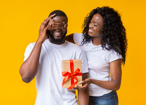 Making gift to boyfreind. African girl with her lover