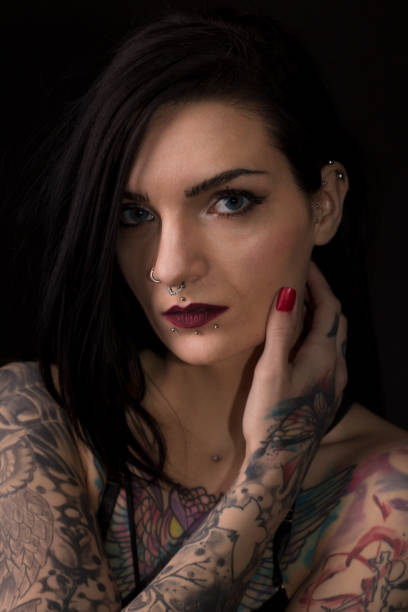 istock Beautiful woman with tattoos 1169958034