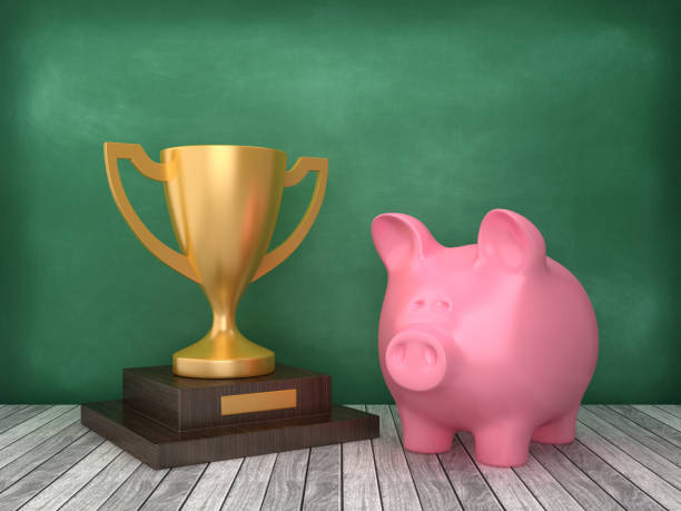 istock Piggy Bank with Trophy on Chalkboard Background - 3D Rendering 1169959972