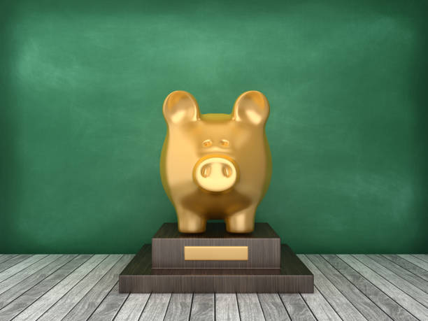 istock Piggy Bank Trophy on Chalkboard Background - 3D Rendering 1169959976