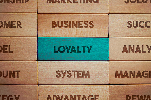 Loyalty related words on wooden blocks