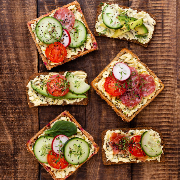 istock Sandwiches with cream cheese, vegetables and salami. 1169962918