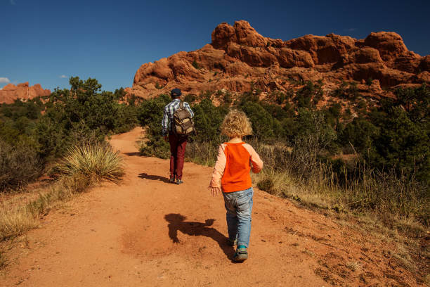 istock A man with his son are hiking in mountains 1169968486