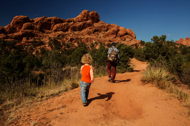 istock A man with his son are hiking in mountains 1169968533