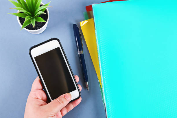 istock Procrastination, delay and urgency concept. The phone distracts from the work social network alerts. 1169969691