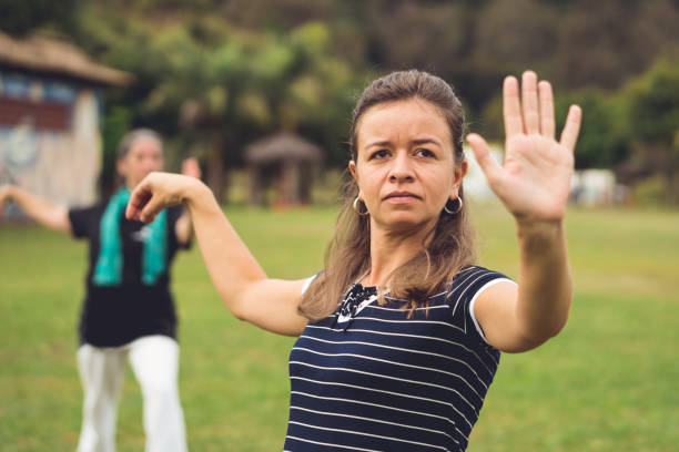 istock Women practicing self defense outdoors 1169971925