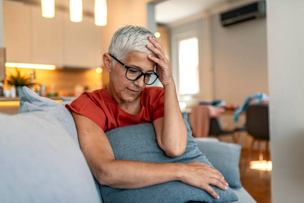 istock Stressed senior woman at home 1169975820
