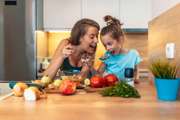 istock Happy family in the kitchen 1169976552