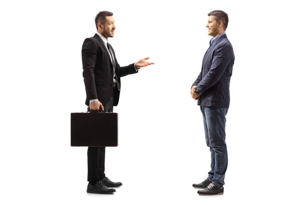 istock Businessman talking to a man 1169977606