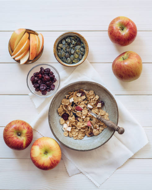 istock Bowl of breakfast cereal with apples and pumpkin seeds 1169980037
