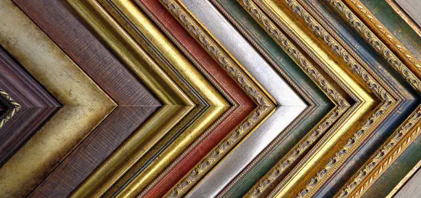Photo of Vintage background of picture frames and baguettes.