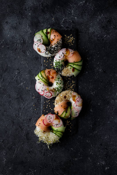 istock Sushi donuts on dark background. Top view. 1169980151