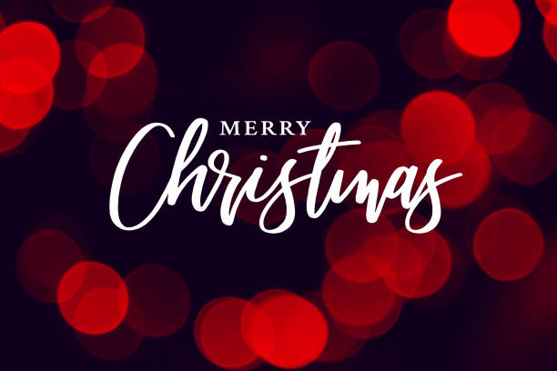 istock Merry Christmas Calligraphy with Red Lights Background 1169980922
