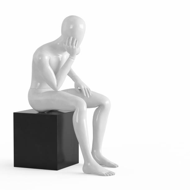 istock A white mannequin sits on a black box with his elbows facing his hand.rendering on a white background 1169981942