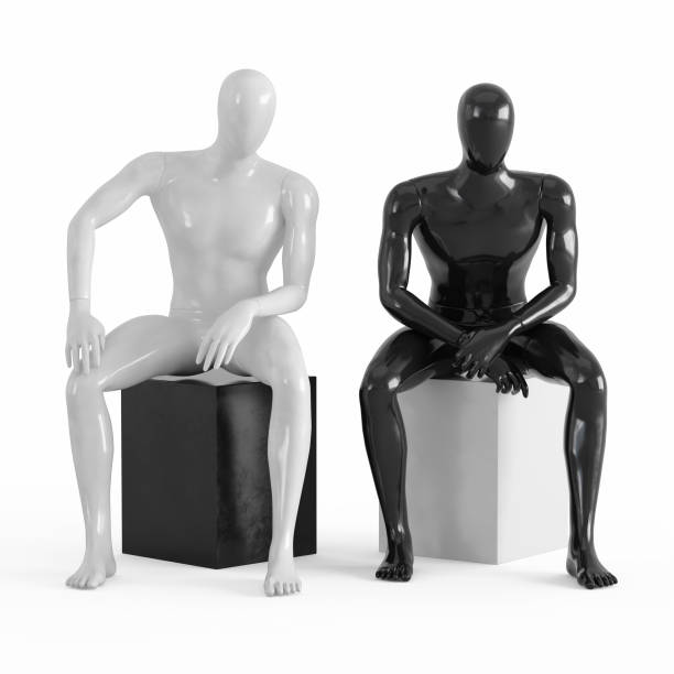 istock Two mannequins without faces are sitting on a black and white box. Black and white plastic 3D 1169981950