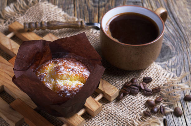 istock Muffin in paper and coffee 1169982291