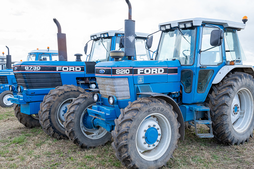Haselbury Plucknett.Somerset.United Kingdom.August 18th 2019.A row of classic Ford tractors are parked in a row on display at a yesterdays farming event