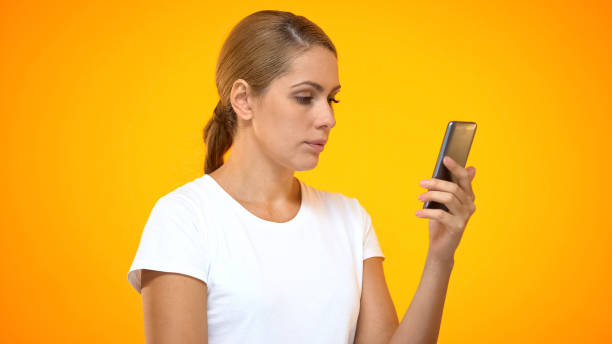istock Young woman reading smartphone message, social networks app, internet connection 1169983659